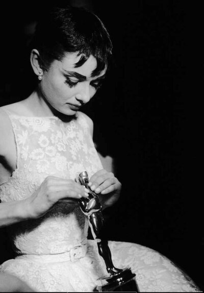 Audrey Hepburn on stage accepting her Oscar for Best Actress in a Leading Role for her performance in Roman Holiday in New York, March 25th, 1954 ​​​