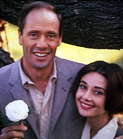 Audrey Hepburn and Mel Ferrer with their pet dog, Famous, outside their home in Los Angeles, CA,1957. ​​​