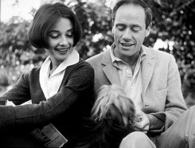 Audrey Hepburn and Mel Ferrer with their pet dog, Famous, outside their home in Los Angeles, CA,1957. ​​​