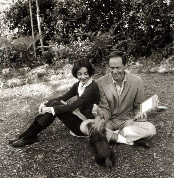 Audrey Hepburn and Mel Ferrer with their pet dog, Famous, outside their home in Los Angeles, CA,1957. ​​​