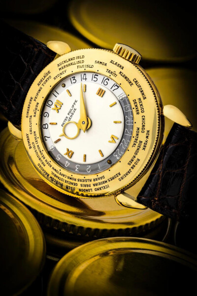百达翡丽，超卓及非常罕有，18K金世界时间腕表，型号1415，百达翡丽短签名表盘，1948年制
估价：港元 1,500,000 - 3,000,000