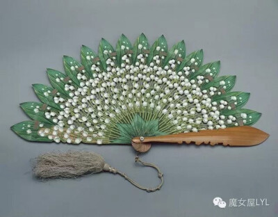 Folding fan with blades in the shape of flowers and leaves of lily of the valley Austria. The end of the 1860s. Wood, pearl, silk thread, paint, thread. (Belonged to Empress Maria Feodorovna, wife of …