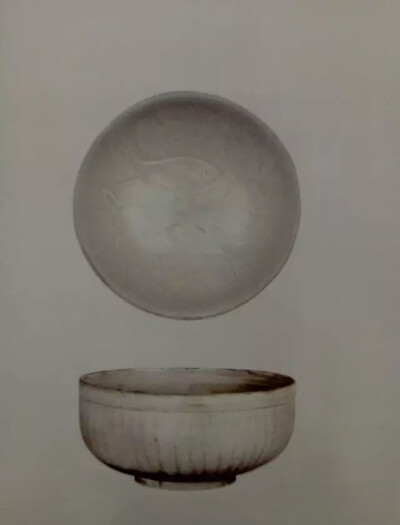 宋代  定窑外莲瓣内双鱼纹碗
北京故宫博物院藏
