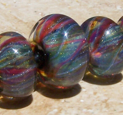 Graduated Sparkley Striped Lampwork Boro Beads in by BurkhartBeads Graduated Sparkley Striped Lampwork Boro Beads in tones of silver。