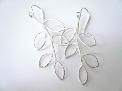 Silver earrings with cascading leaves by minusOne on Etsy Silver earrings with cascading leaves.