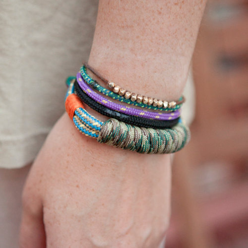 Glamour Tumblr Now that’s one good looking arm party. Camo camping cord bracelet, $30, Move Slightly on Etsy