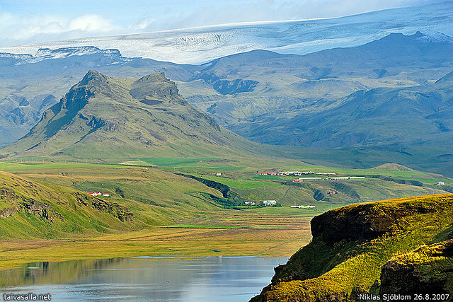 Iceland, Dyrhólaey: North-northwestern view from the cliff of Dyrhólaey, a more than 100 metres (330 feet) high promontory at the southernmost point of Iceland. The glacier in the background is Mýrdalsjökull.