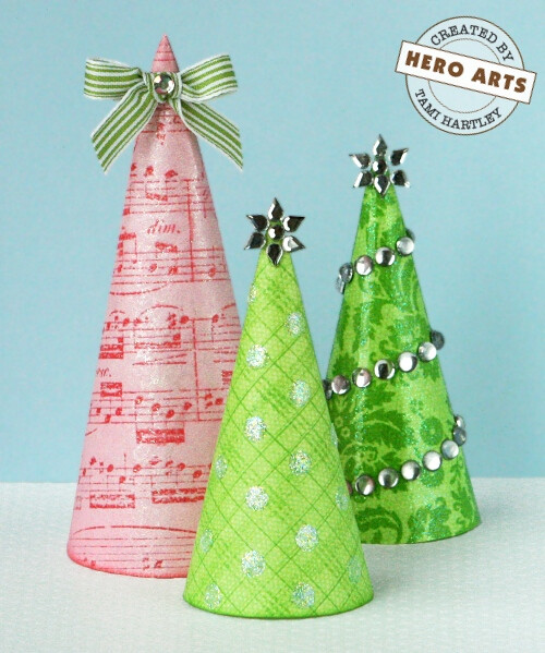  Paper Cone Christmas Trees By Tami Hartley Make the season sparkle with charming paper cone trees!Hero Materials:CH153 Smooth Clear GemstonesCH193 Star Gem ShapesCH235 Diamond GemsMI004 Mini Glue DotsPG104 Ultra Fine Prisma Glitter<br />PW105 Embossing Powder - Sparkle<br />PW112 Perfect Pea