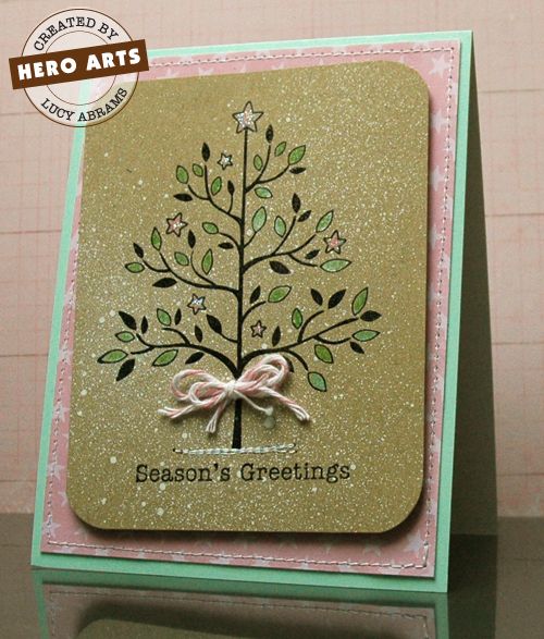 Season's Greetings By Lucy Abrams Watch as Lucy Abrams creates a holiday card using non-traditional colors. Instructions: Trim a sheet of Snow Layering Paper to 4 1/4 x 11". Score and fold to create a top folding notecard. Mat notecard with patterned paper.
<br />Trim kraft cardstock