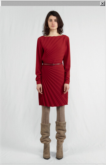 Pleated dress with thin leather belt worn with wool leggings and sheepskin boots.