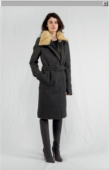 Wool and cotton coat with metal hook closure and sheepskin collar worn with a Milano jersey dress and boots in rubber tweed leather.