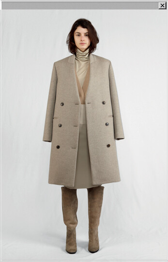 -Double-face cashmere collarless coat worn with a jersey roll-neck sweater, a cashmere cardigan, a wool high-waisted skirt and sheepskin boots.