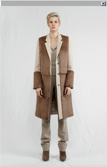 Wool coat with rabbit fur applications and detachable waiscoat worn with a goat fur waistcoat, a jersey roll-neck sweater, leather jeans and leather ankle boots.