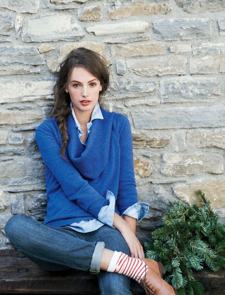 Blue sweater and striped socks.