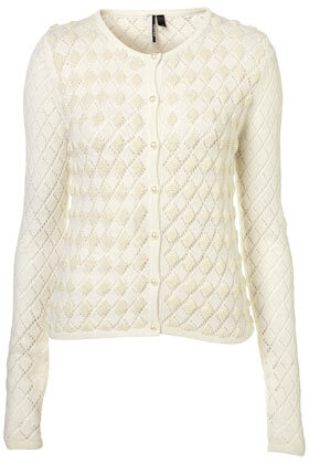 Knitted cream diamond pattern cardigan with faux pearl embellishment detail on the front. 58% Nylon,34% Wool,8% Angora. Cool hand wash.