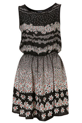 Black and white daisy stripe print sleeveless dress with high neckline and elasticated waist. 100% Polyester