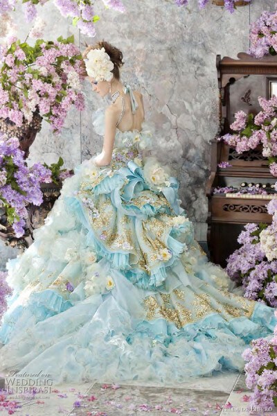 Strapless ball gown with painted tulle skirt dotted with large fabric roses.