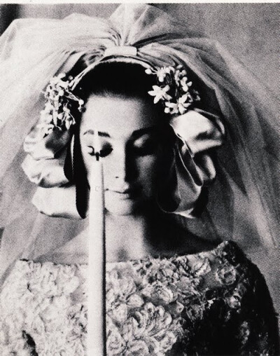 Christian DiorModel is wearing a Bride creation by Christian Dior and photographed by Bourdin.French Vogue,March 1961.
