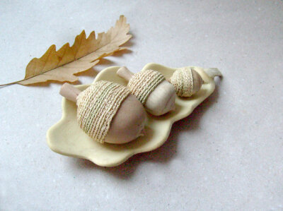 Hand sculpted acorns with a unique oak leaf bowl