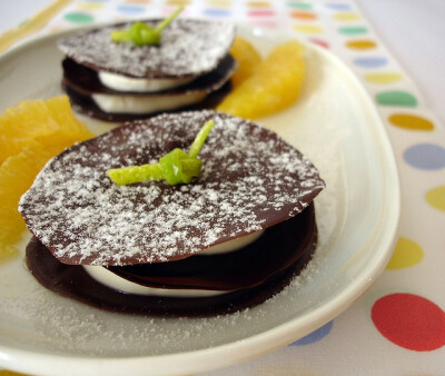 Chocolate with orange cream and marinated oranges