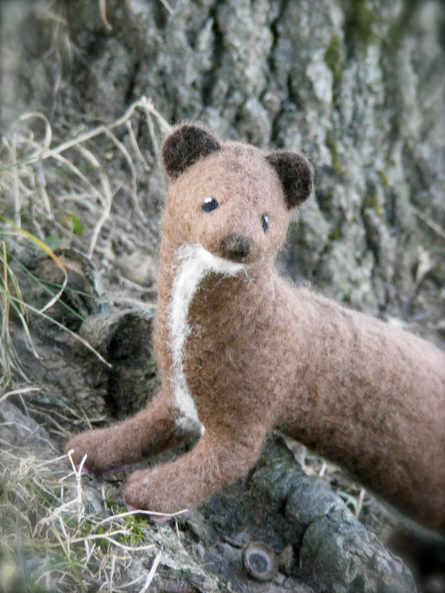 Needle Felted Female Posable Minkby *Artist4Life05This is a life size posable needle felted mink. I used a wild female mink pelt as a reference for this girl. She took a little under 3 days of work.She is fully posable and has pads on the bottom of her feet.