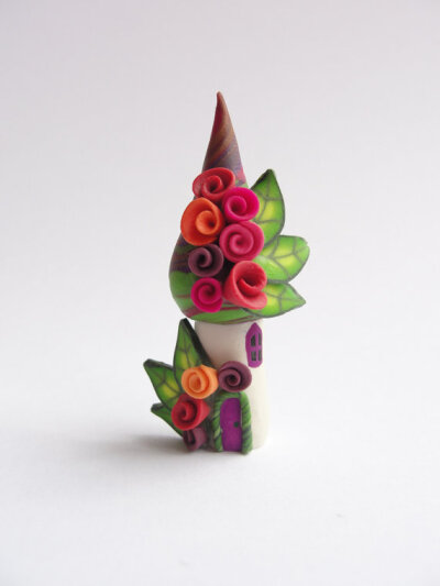 Miniature rose fairy home in orange purple lime