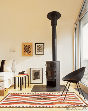 A 1950s Donald Knorr metal chair in the sitting room of a New York townhouse; the Navajo rug dates from the early 1900s.