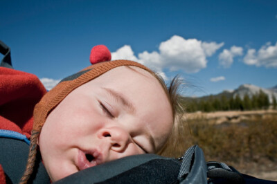 Young boy (6-12months) asleep with hat on.(by Siri Stafford)