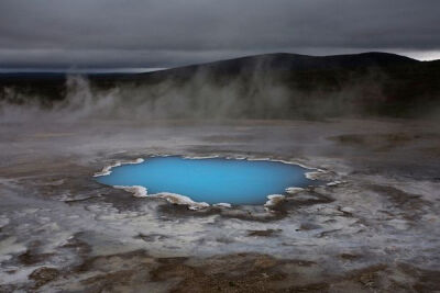 One of the highlights of the interior of Iceland: a hot-water pond, charged with silica, glowing in the middle of nowhere.