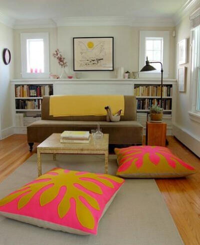 I am loving the casual comfy look of the large #neon #pink & mustard pillows on the floor of this living room.