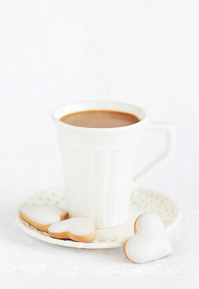 hot cocoa with white chocolate frosted cookies