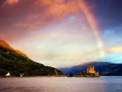 Photo: Rainbow over a castle on an island in a lake -- Eilean Donan Castle