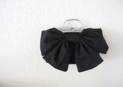 Black bow clutch with handle-