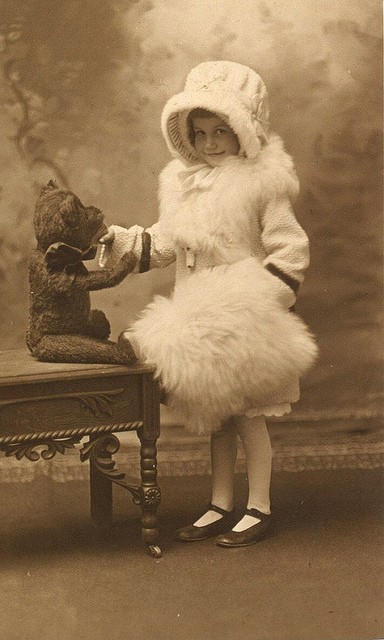 Girl with teddy bear. Vintage American photo, Julesburg, Colorado studio, c. 1920. The bear looks like a Steiff to me.