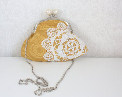 clutch purse with vintage fabrics and lace doily