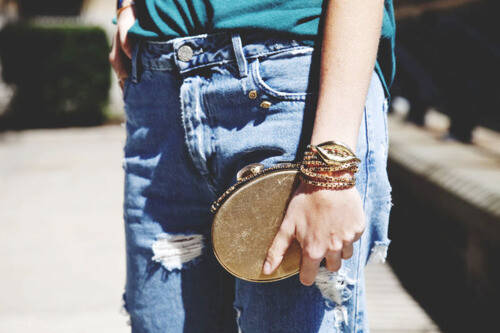  Acne jeans, Aurelie Bidermann lip adorned bracelet, Ferragamo clutch. (image: manrepeller)