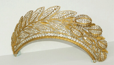 French tiara, c. 1820, is set in a patterned, gilded frame with faceted crystals. It depicts a spray of hyacinth leaves with raised flower buds