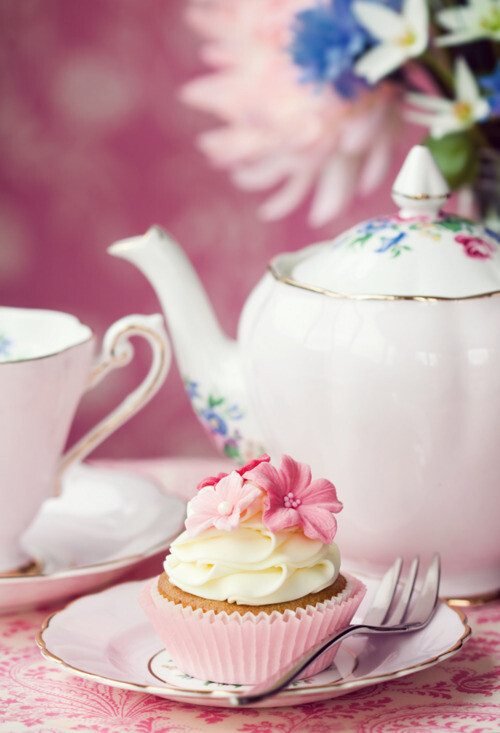 pink and white cupcake with swiss meringue buttercream.