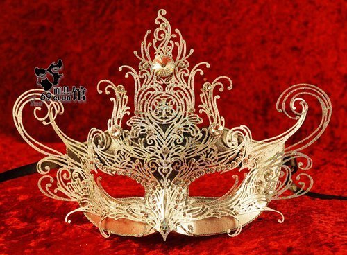 Hand-decorated mask, made in Venice according to traditional artisan techniques. Beautifully decorated with a large array of spray painted colours, high quality glitter, choice pearls, and hand-bent metal appliqués studded with Swarovski crystals; Satin ribbon ties to fit the mask comfortably. The