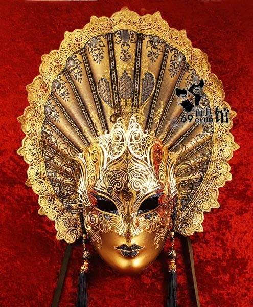 Hand-decorated mask, made in Venice according to traditional artisan techniques. Beautifully decorated with a large array of spray painted colours, high quality glitter, choice pearls, and hand-bent metal appliqués studded with Swarovski crystals; Satin ribbon ties to fit the mask comfortably.