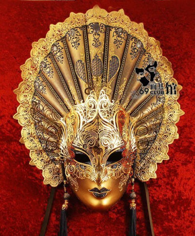 Hand-decorated mask, made in Venice according to traditional artisan techniques. Beautifully decorated with a large array of spray painted colours, high quality glitter, choice pearls, and hand-bent m…