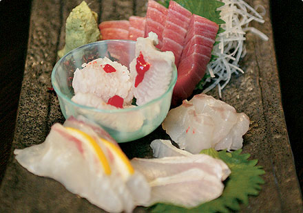 Sashimi is fresh, raw fish that is sliced very thinly and served uncooked. A traditional Japanese dish, it is usually served with daikon radish, pickled ginger, wasabi and soy sauce as the first course in a meal.