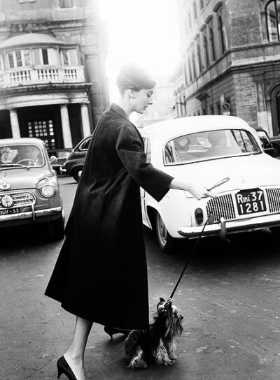 Audrey Hepburn with her dog, Rome, 1961.