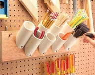 Short PVC pieces keep things organized Would be great for sewing room/craft room.