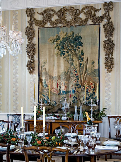 Holly branches on the center of the dining room table and on the buffet are a classic way to bring the Christmas spirit into your home.