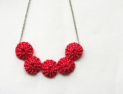 http://www.etsy.com/listing/99729424/yoyo-necklace-red-white-polka-dot-cotton