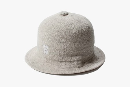 Stussy 2012 夏季 Fiesta Bucket Hat 渔夫帽款 设计上跟「Bermuda」一样带点渔夫帽的风格，但就用上鲜见的的软身素材打造，并于帽身上绣有品牌的字样及表现出热带气式的图桉，备有海军蓝色及浅灰色以供选择。