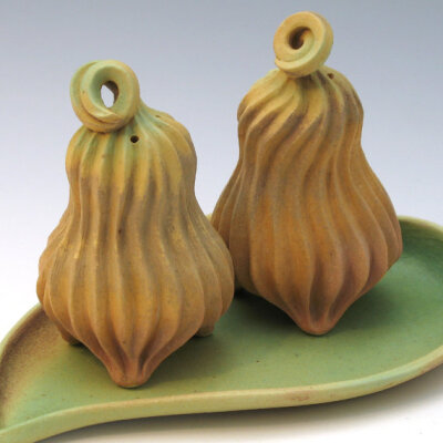 Green, tan and brown carved porcelain salt & pepper set with curly tops