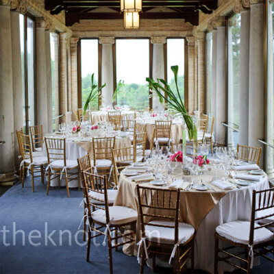 The reception took place in three rooms at the estate. Round tables were set up in the charming, window-lined portico.