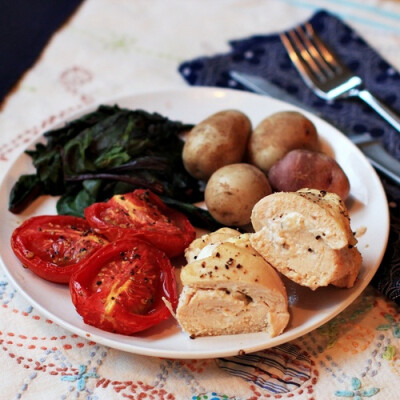 Goat cheese stuffed chicken with roasted tomatoes